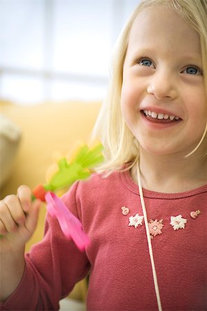 Little girl playing with clapping toy, laughing Stock Photo - Premium Royalty-Free, Code: 632-02645123