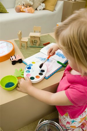 Little girl painting with watercolors Stock Photo - Premium Royalty-Free, Code: 632-02645153