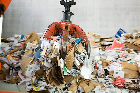 Waste paper being processed in recycling center Stock Photo - Premium Royalty-Free, Code: 632-02690419
