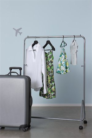Family's summer clothes hanging on clothes rack, ready for vacation Stock Photo - Premium Royalty-Free, Code: 632-02745293