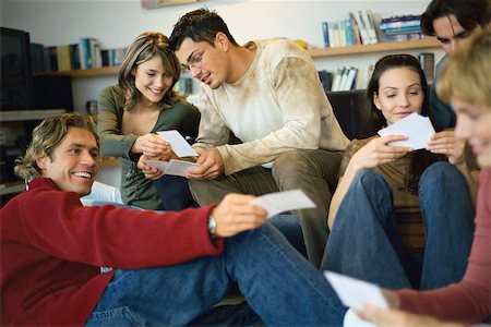 stage show - Gathering of friends looking at photos Stock Photo - Premium Royalty-Free, Code: 632-03026787