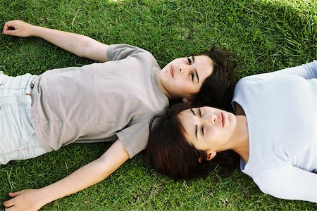 simsearch:614-06043612,k - Mother and son reclining together in grass, viewed from directly above Stock Photo - Premium Royalty-Free, Code: 632-03027005