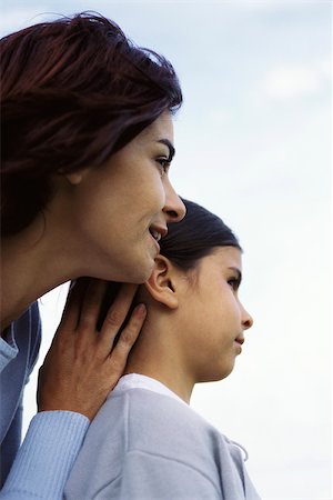 simsearch:632-03424324,k - Mother standing behind young daughter, looking over shoulder, cheek to cheek, both admiring view Stock Photo - Premium Royalty-Free, Code: 632-03027009
