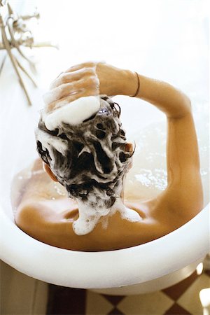 shampoo - Woman in bathtub shampooing hair, rear view Stock Photo - Premium Royalty-Free, Code: 632-03027031