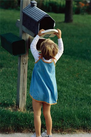 Little girl checking mailbox Stock Photo - Premium Royalty-Free, Code: 632-03027081