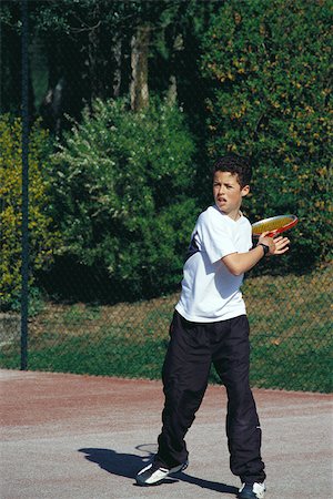 Boy playing tennis Stock Photo - Premium Royalty-Free, Code: 632-03027098