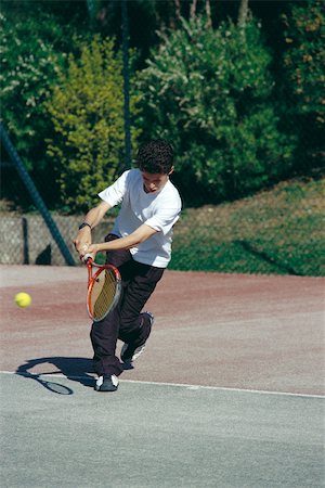 Boy playing tennis Stock Photo - Premium Royalty-Free, Code: 632-03027099