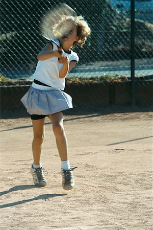 Little girl playing tennis Stock Photo - Premium Royalty-Free, Code: 632-03027103