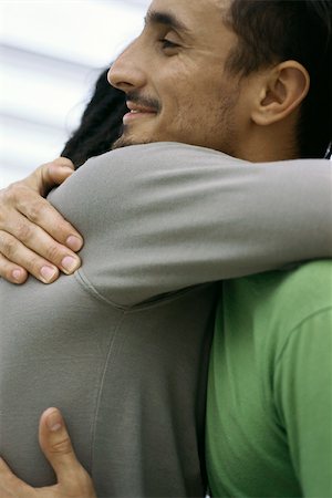 Friends hugging Stock Photo - Premium Royalty-Free, Code: 632-03027141