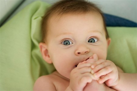 simsearch:632-03027302,k - Baby with foot in mouth, close-up Stock Photo - Premium Royalty-Free, Code: 632-03027305