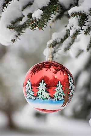 simsearch:700-01538773,k - Colorful Christmas ornament hanging from snow-covered branch Stock Photo - Premium Royalty-Free, Code: 632-03027628