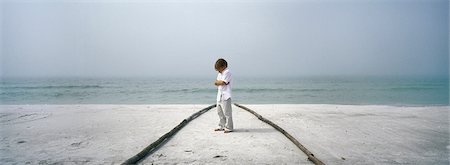 simsearch:695-03380694,k - Little boy sulking on beach, arms folded Stock Photo - Premium Royalty-Free, Code: 632-03083088