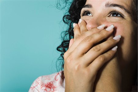 embarrassed women - Woman covering mouth with hands, portrait Stock Photo - Premium Royalty-Free, Code: 632-03083129
