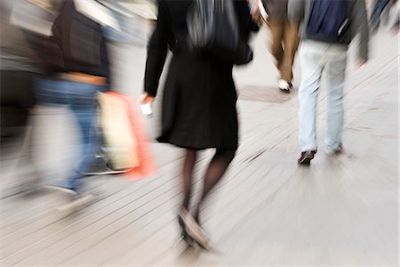 panning (camera technique) - Pedestrians walking on sidewalk, rear view, blurred Stock Photo - Premium Royalty-Free, Code: 632-03083468