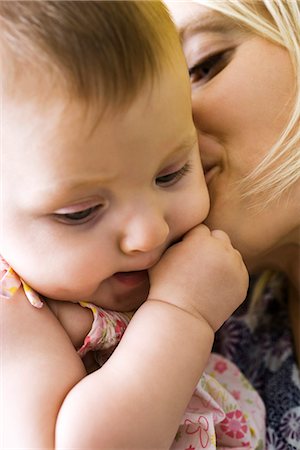 Mother kissing infant's cheek, close-up Stock Photo - Premium Royalty-Free, Code: 632-03083558