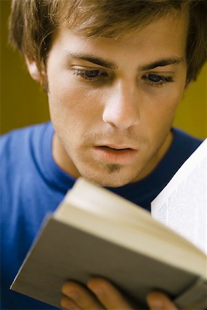 simsearch:632-03083700,k - Young man reading book Stock Photo - Premium Royalty-Free, Code: 632-03083639