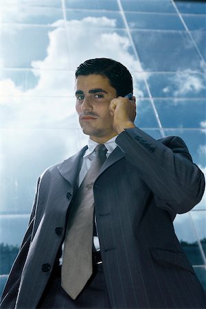 simsearch:632-03083042,k - Businessman using cell phone outside office building Stock Photo - Premium Royalty-Free, Code: 632-03083702