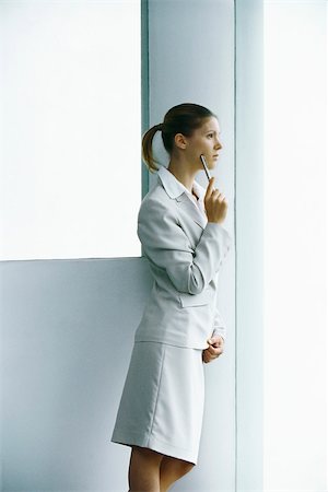 simsearch:632-03083042,k - Businesswoman waiting at entrance looking away thoughtfully Stock Photo - Premium Royalty-Free, Code: 632-03083718