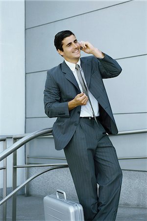 simsearch:632-03083042,k - Businessman using cell phone, leaning against railing Stock Photo - Premium Royalty-Free, Code: 632-03083720