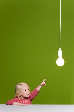 simsearch:632-01193783,k - Little girl pointing at illuminated light bulb suspended overhead Stock Photo - Premium Royalty-Free, Code: 632-03193345