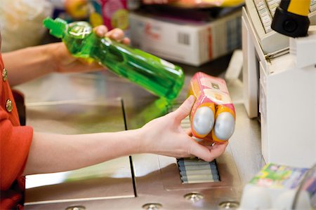 supermarket cashier - Cashier scanning items at checkout counter, cropped Stock Photo - Premium Royalty-Free, Code: 632-03193783