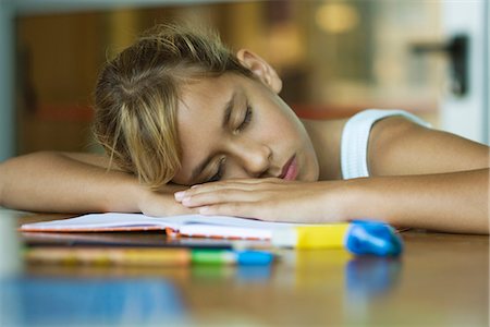 sleep book - Preteen girl napping, resting head on arms laid across open book Stock Photo - Premium Royalty-Free, Code: 632-03424212