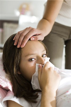 person blowing nose pic - Girl with head cold, mother caressing forehead Stock Photo - Premium Royalty-Free, Code: 632-03424326