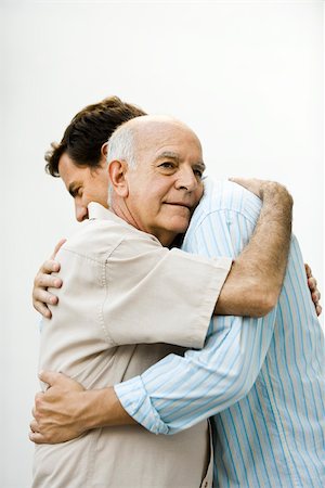 Senior man embracing adult son Stock Photo - Premium Royalty-Free, Code: 632-03424369