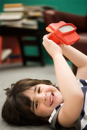 simsearch:632-03424261,k - Little boy with toy viewfinder Stock Photo - Premium Royalty-Free, Code: 632-03424647