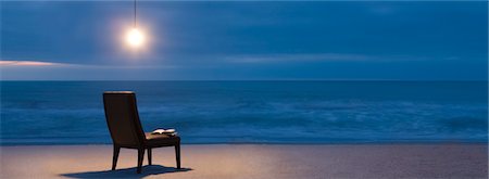 Light bulb illuminated over chair on beach at night Stock Photo - Premium Royalty-Free, Code: 632-03500619