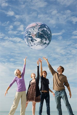 Ecology concept, group of people saving the earth together Stock Photo - Premium Royalty-Free, Code: 632-03500792