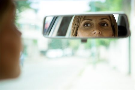 Driver checking rear view mirror Stock Photo - Premium Royalty-Free, Code: 632-03500891