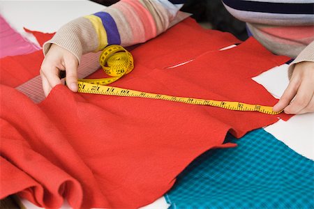 seamstress - Measuring fabric Stock Photo - Premium Royalty-Free, Code: 632-03501035