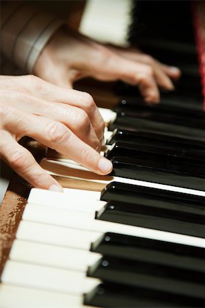 playing music - Playing piano, close-up Stock Photo - Premium Royalty-Free, Code: 632-03516378