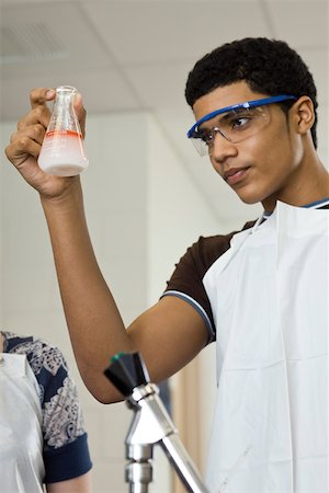 High school student conducting experiment in chemistry class Stock Photo - Premium Royalty-Free, Code: 632-03516587