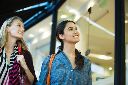 Friends window shopping together Stock Photo - Premium Royalty-Free, Code: 632-03516697