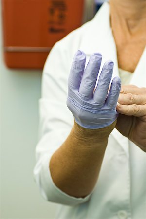 Taking off disposable latex glove Stock Photo - Premium Royalty-Free, Code: 632-03516726