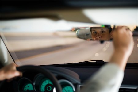 driver (vehicle, male) - Driver driving adjusting rearview mirror Stock Photo - Premium Royalty-Free, Code: 632-03516815