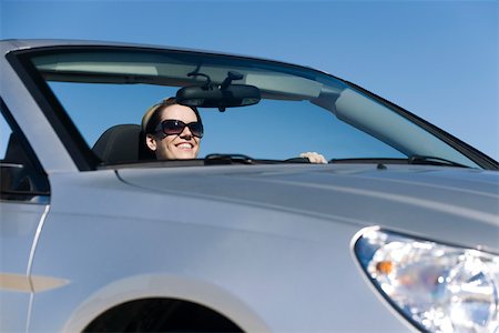 Woman enjoying pleasure drive on sunny day Stock Photo - Premium Royalty-Free, Code: 632-03516869