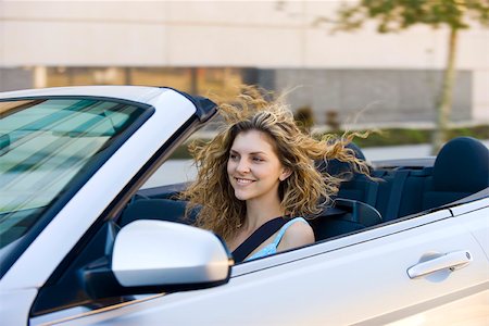 simsearch:632-05401320,k - Young woman driving convertible Stock Photo - Premium Royalty-Free, Code: 632-03516873