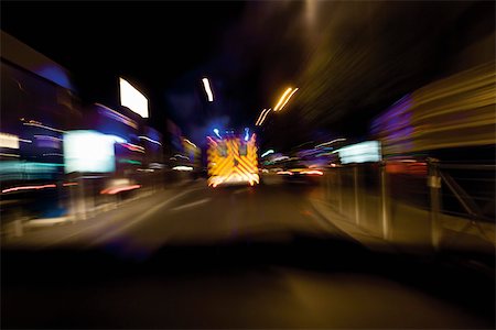 panning (camera technique) - Ambulance rushing down street at night Stock Photo - Premium Royalty-Free, Code: 632-03629655