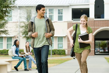 High school friends walking together on campus Stock Photo - Premium Royalty-Free, Code: 632-03630150