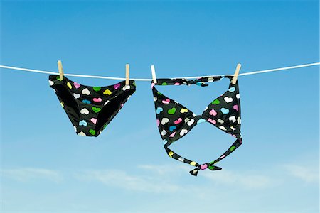 swimsuits not on people - Bikini hanging on clothes-line Stock Photo - Premium Royalty-Free, Code: 632-03651829