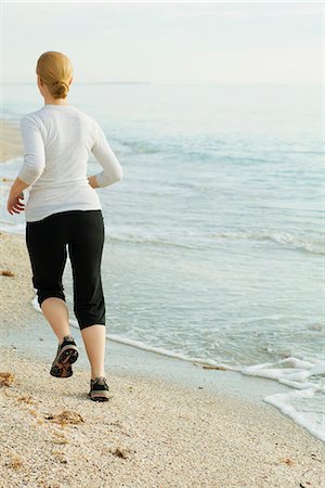 simsearch:633-01715682,k - Woman jogging at the beach Stock Photo - Premium Royalty-Free, Code: 632-03651836