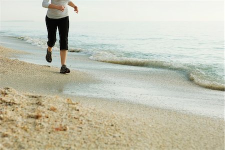simsearch:633-01715682,k - Woman jogging at the beach, low section Stock Photo - Premium Royalty-Free, Code: 632-03651838