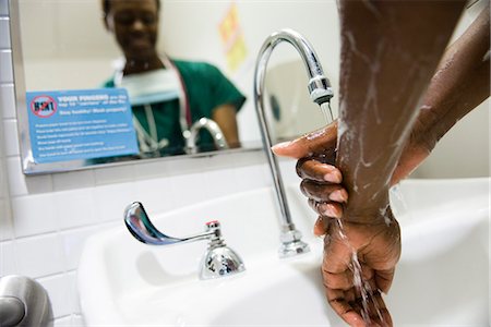 Healthcare worker washing hands Stock Photo - Premium Royalty-Free, Code: 632-03651971