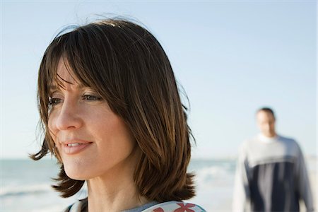 simsearch:632-05845617,k - Woman at the beach, looking away in thought Stock Photo - Premium Royalty-Free, Code: 632-03651997