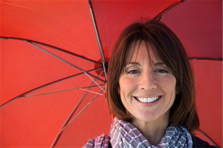 positive thought - Mature woman under umbrella, portrait Stock Photo - Premium Royalty-Free, Code: 632-03651993