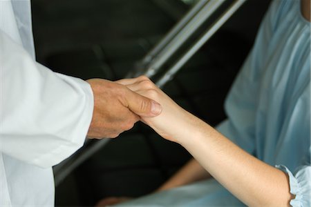 simsearch:694-03331631,k - Doctor holding patient's hand Stock Photo - Premium Royalty-Free, Code: 632-03754364