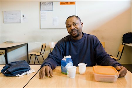 Factory worker having lunch in breakroom Stock Photo - Premium Royalty-Free, Code: 632-03754526